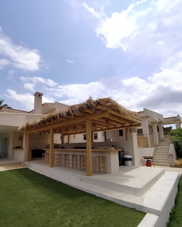 Renovated villa in Ibiza with wooden porch and outdoor bar