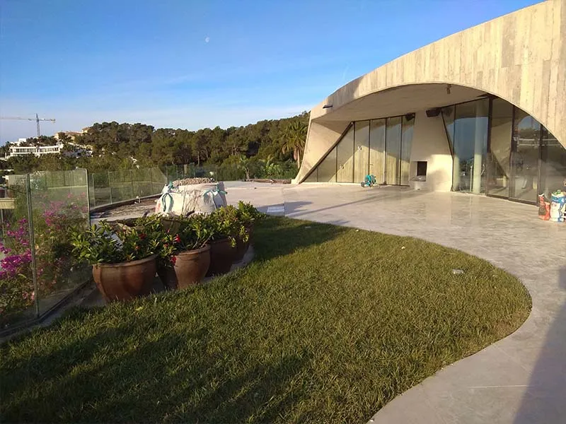 Luxury villa renovation in Ibiza with modern architecture and landscaped terrace