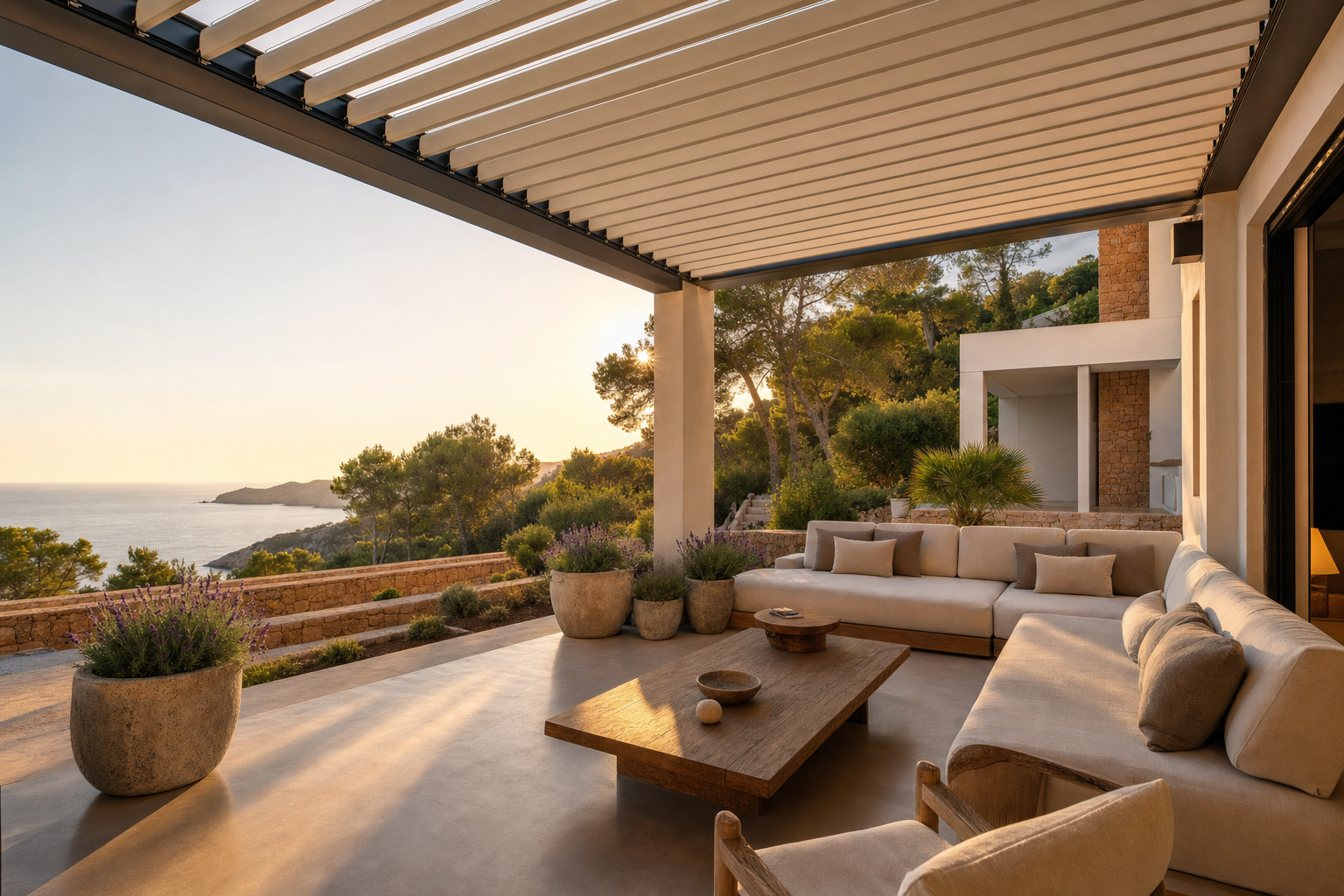 Luxury Ibiza villa terrace with bioclimatic pergola open at golden hour